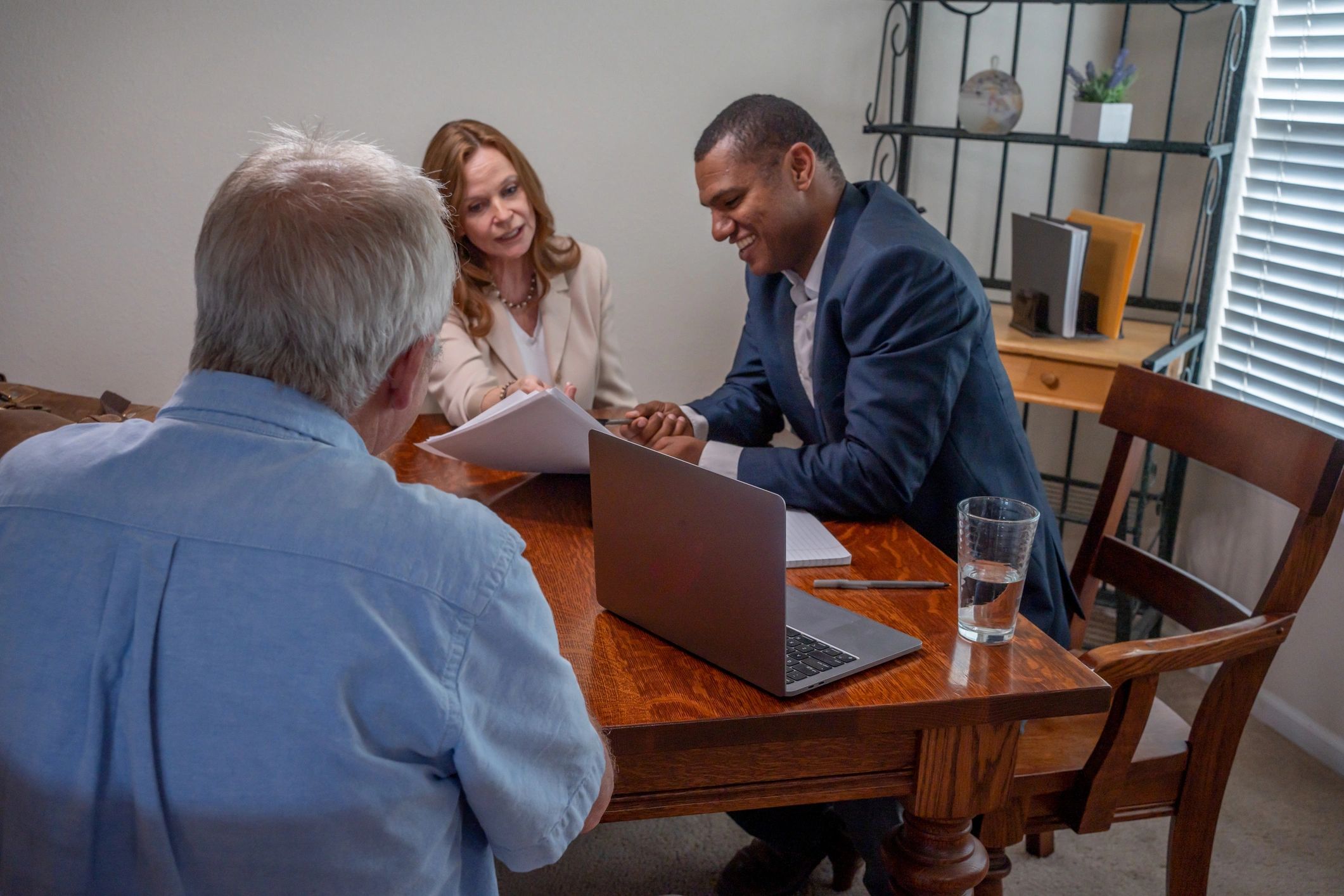 Attorney discussing planning options with clients at a table